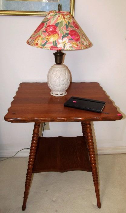 Vintage Tiger Oak Table with rich finish, nicely scalloped accents, spindled legs, and bottom shelf storage; Also shown is a Vintage Aladdin Alacite Art Deco  Table Lamp w/ Grape Leaves Ivy Vines