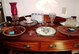 Vintage Sideboard with rich finish, serpentine style front, 2 drawer storage with Hepplewhite pulls, and bottom shelf storage; Also shown are some of the collection of Vintage  Rock Crystal Clear Depression Glassware; Vintage Amber Depression Glassware that are available in this sale. This sale has one of the largest collections of Rock Crystal Depression glasswares that we have ever seen.  Items on top of the Sideboard include Vintage Rock Crystal Amber Depression glassware items such as the  Handled Server, and Cake Server, Vintage Hazel Atlas Shot Glass Set, Footed Plateau, Franz Porcelain, Vintage Rock Crystal Depression Footed Dish,  Vintage Accent Table Lamp  / Night Light with cranberry glass globe and lovely hanging crystal lustres ;  Items on the Bottom Shelf include Vintage  McKee Rock Crystal Egg Server,  and Vintage Rock Crystal dishes with gold tone borders.