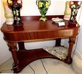 Vintage Foyer Table  with rich finish, nicely carved and reeded legs, 2 beveled drawers, bottom platform, caster mounted; Also shown are Vintage Majolica vases / urns, and a Pair of Matching  Vintage Mid Century Aladdin Lamps with Alacite glass stands... with a striking "Chartreuse" (lime-green) color background...  and a beautiful fused "Lily of the Valley" design accent (likely Circa 1950's). 