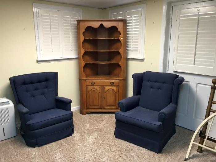 Corner cupboard and lounge chairs.
