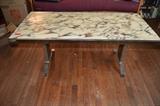 German coffee table with marble top.  There is a crank on the side to allow you to adjust height.