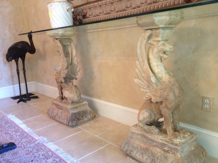 Antique French Terracotta Griffons with glass Top. Used as a console table. Can be used outdoors as well.