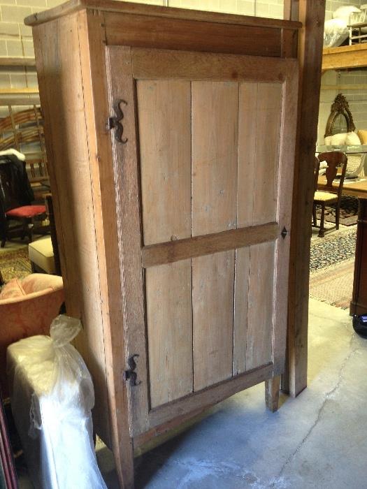 Single door Pine Cupboard used as a closet, (pull out hangar mounted inside)