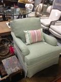 Upholstered club chair, small foot stool, silk pillow