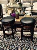 pair of black swivel stools