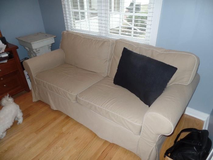 Slip covered sleeper sofa