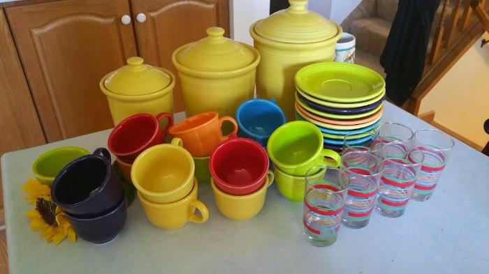 Fiesta ware canisters, cups and saucers and juice glasses