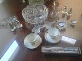 There are many beautiful small pieces. Crystal serving pieces (one American brilliant bowl), figurines, collectible dishware. The cups & saucers, salt & peppers, and serving fork in this photo are sold.