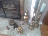 We have a lot of brass candlesticks and fireplace-related pieces. The cowbell and copper pitcher are sold.
