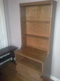 Nice, two-piece shelving unit, and an older magazine rack in the corner.