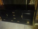 Very nice black buffet, oriental style.