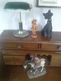 Only the secretary and the small wooden figure (by Robert Steele) remain.