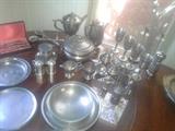 Lots of vintage and probably some antique pewter.
