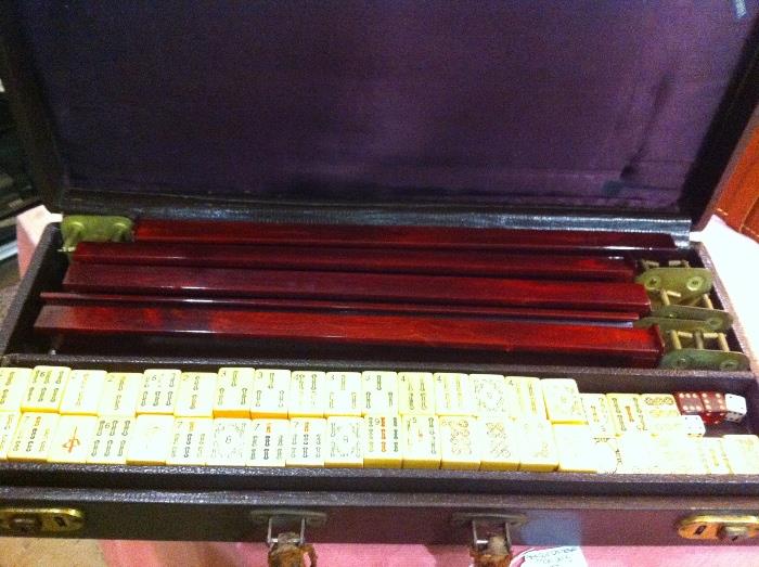 Antique Mah Jong set w/ faux crocodile case. Pieces are Bakelite, wood, and metal. 