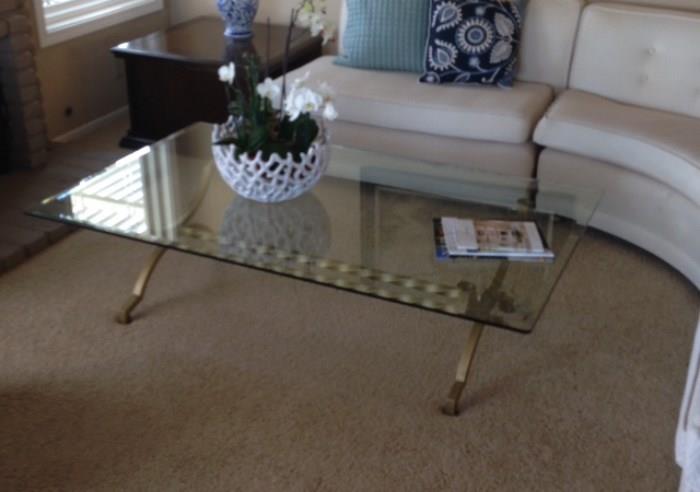 Beautiful glass cocktail table, brass legs, excellent finish.