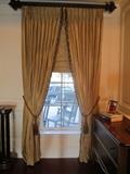 Several sets of silk drapes and roman shades