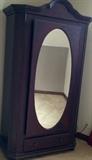 Antique armoire with mirror front