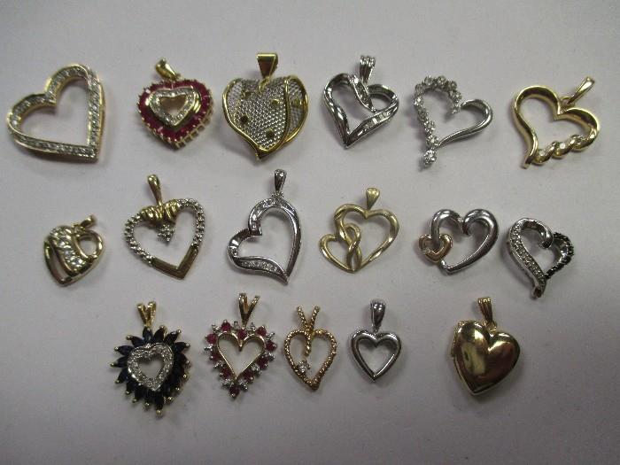 Gold heart pendants with diamond and other gemstones