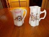 2 Unsigned Floral Pitcher - about 7" - 8" tall