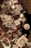 About 100 oz of yet unsearched US silver coins and dollars--some dating back to the mid 1800s, other oz sized foreign silver coins and .999 silver rounds ranging in weight from 1 to 2 lbs each.