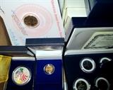 Unsearched boxes of art designer-collector silver coins and a few small gold coins