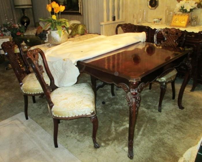  Vintage mahogany table in excellent condition with two leaf extenders to seat ten. Was always covered.