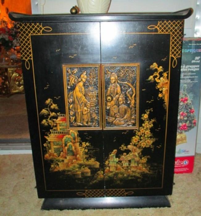 Old Chinese laquered cabinet was formerly used to house a big old TV..but may now be re adapted for a flat screen or turned into a bar