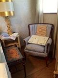 Needlepoint Ottoman, Cherub Figural Lamps and Mahogany Blue Upholstered Arm Chair 