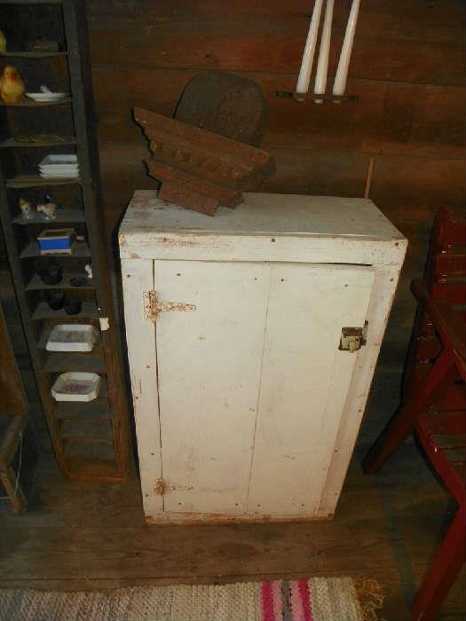 primitive cabinet, iron architectural salvage, chicken feeder 