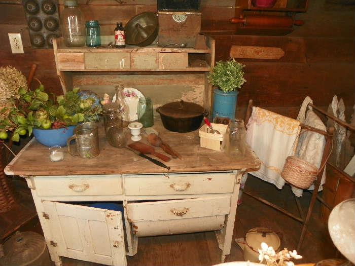 bakers cabinet, drying rack, cast iron pot, mason jars, lunch pail, primitive wooden utensils, 