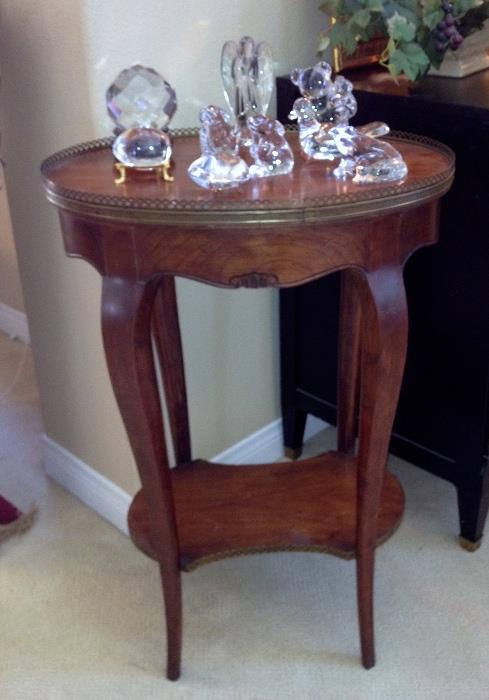 French gallery side table with Baccarat crystal animals. 