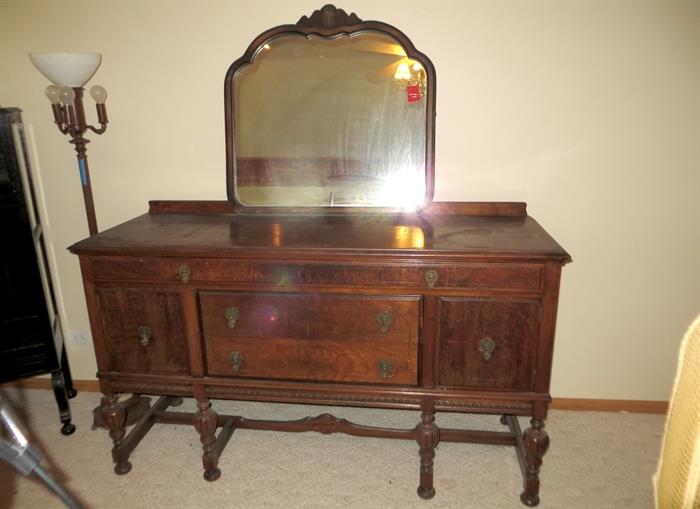 Antique buffet cabinet. Mirror does not belong to it.