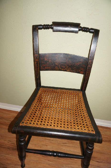 Antique chair with cane seat and stretcher