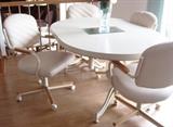 beige kitchen table with 4 chairs and a leaf, chairs on casters