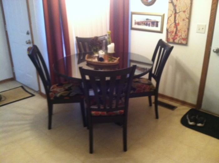 Dining table with glass top (can be taken on or off) and 4 chairs custom covered.  