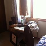 Towels, wicker waste baskets and Kleenex holder, wicker laundry hamper.  Be sure to notice the antique round table with inlays that flips up for storage...right in the forefront of this shot.