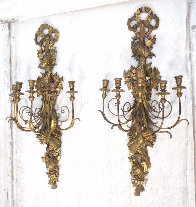 Lot 128:  Pair of Italian Carved Wood and Iron Wall Sconces.  5 Arm with heavily craved gilt back.  : Dimensions:  H: 44 inches: W: 22 inches: D: 11 inches --- 