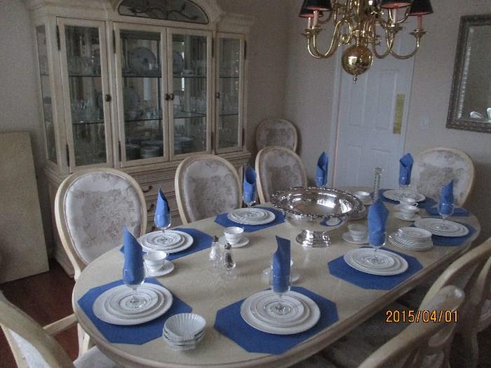 Dining Table Shown Here with only 1 of 2 Leaves (both leaves are included with price on Table and Chairs); Royal Doulton English Bone China Place Settings (additional place settings are included and all sold for one money); Stunning Large Punch Bowl with Ladle; Waterford Salt and Pepper Shakers (sold as pair).