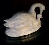 Ceramic ducks on stand.