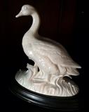 Ceramic duck on stand.