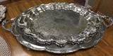 Several large silver plate trays and much more silver plate serving pieces.