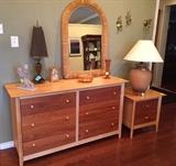 Copeland maple and cherry dresser with matching nightstand, pottery lamp, rattan mirror