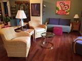 Pair of Pier One rattan chairs, Carter sofa, vintage brass and glass side table, lamps.