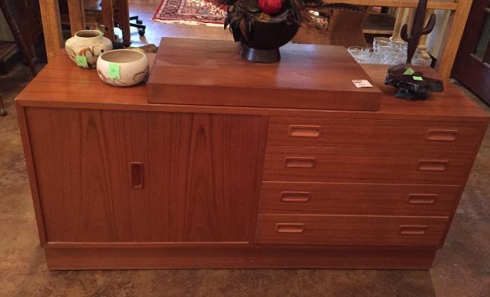 Teak mid-century dresser with swivel stand for TV on top.