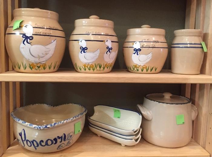 Pottery canisters, pottery popcorn bowl, crock, corn holders.