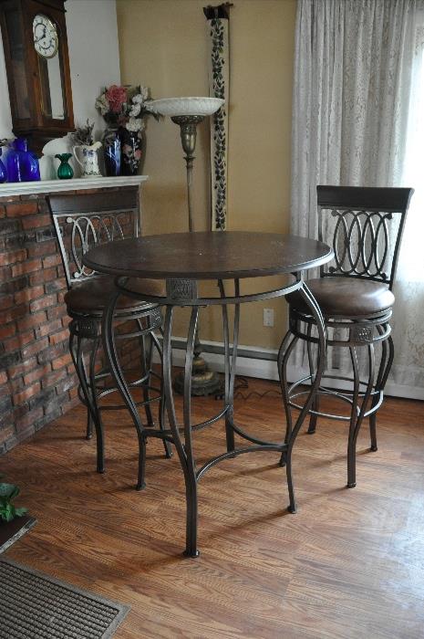 Wrought Iron Round café table with swivel chairs