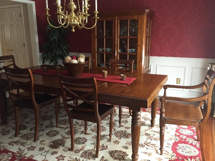 Dining room set with 6 chairs and built-in leaf, seats 10 comfortably.  Matching Hutch/china cabinet. Oriental print carpet