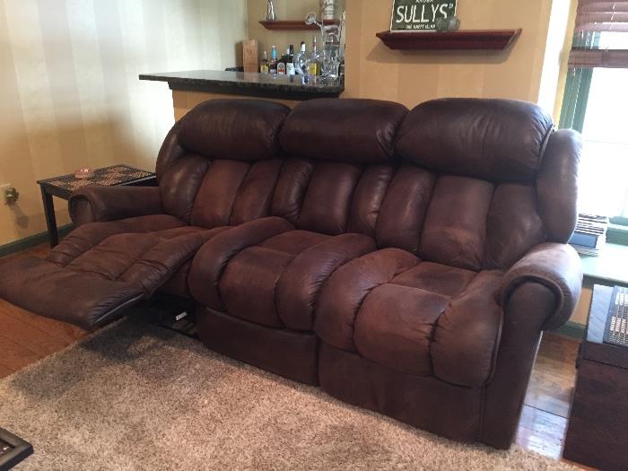 Brown leather-look sofa with recline function on both ends
