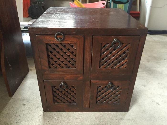 Wooden side table with 4 storage drawers.  Solid teak.