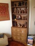 Small Dresser/Hutch holds a variety of Wood Carvings, Ceramics and Vintage Collectibles